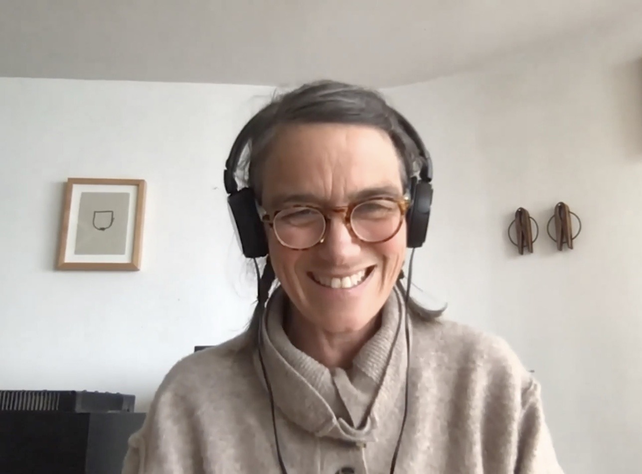 image of person with headphones on while on Zoom"