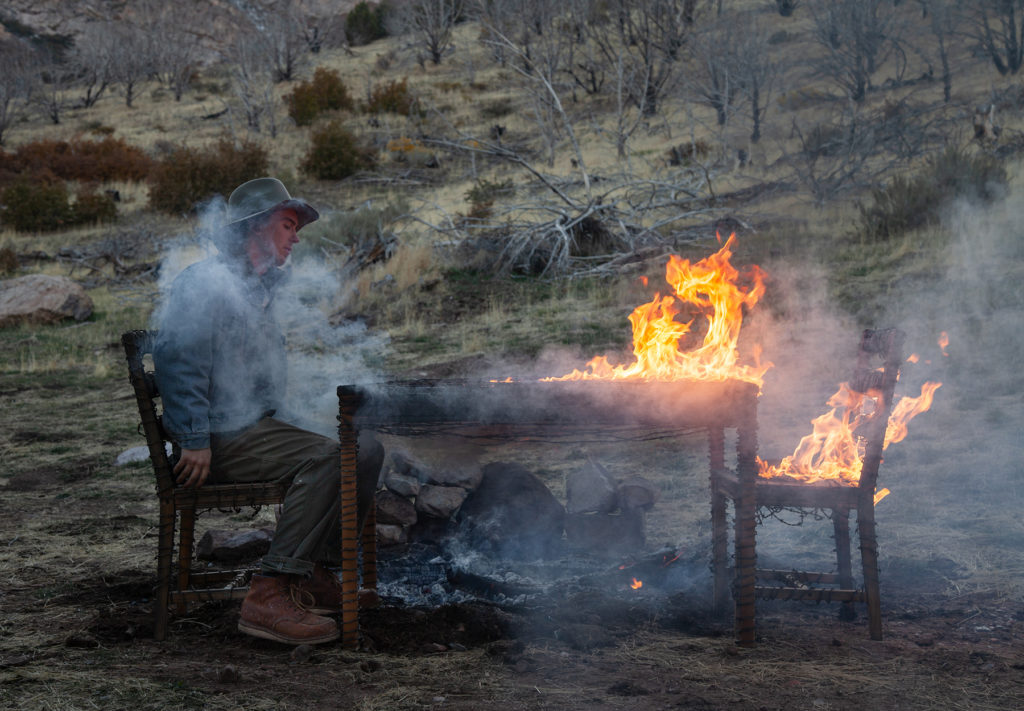 Response &amp; Responsibilty, by Douglas Tolman and Alec Bang, performance, barbed wire, dining set, fire