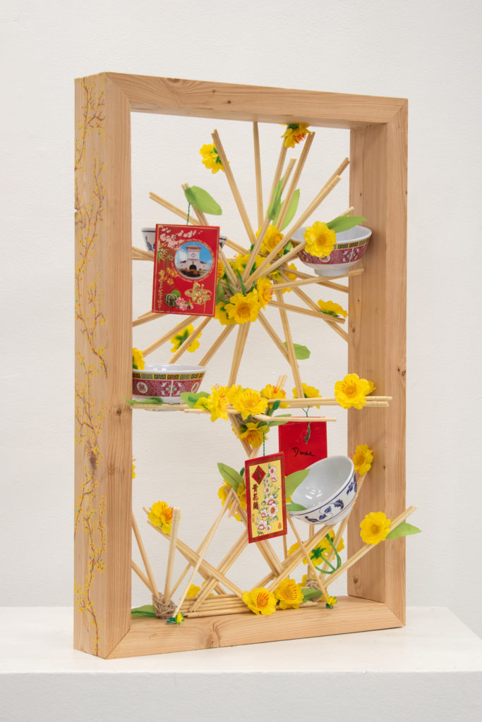 New Years in a Box - Diana Tran, wood, chopsticks, paint markers, twine, plastic bowls, red envelopes, plastic cherry blossoms