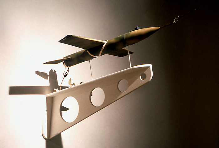 A Contrivance to Hunt Deer At Great Distances (detail of spent missile); Paul Stout, wood, cardboard, paint, plastic, electronics, wooden display bracket, 18 x 18 x 18