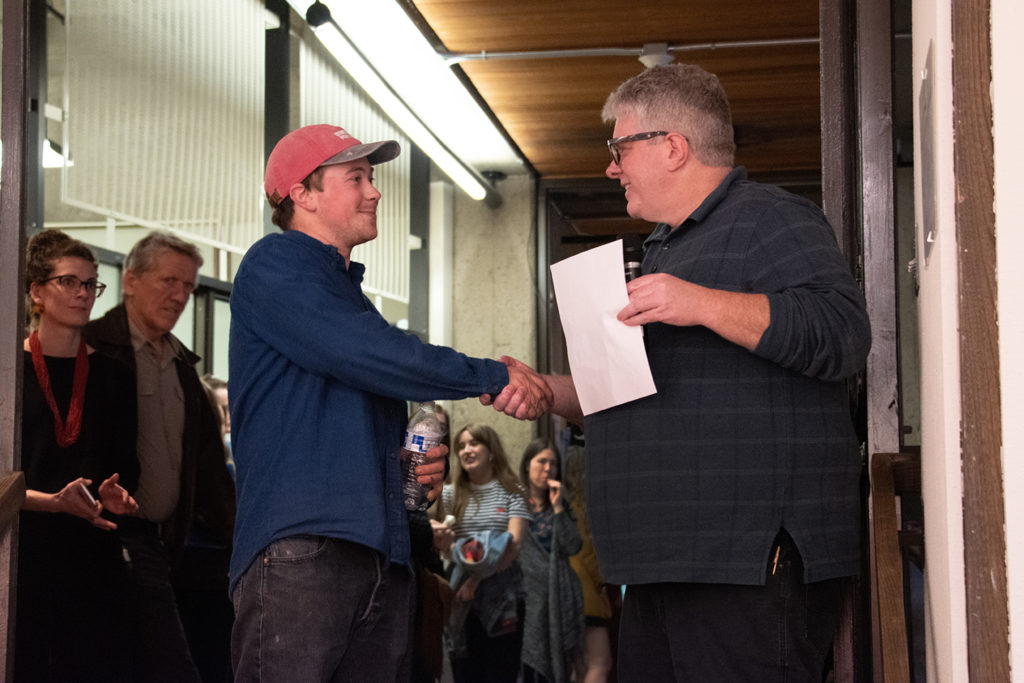 Annual Student Exhibition Opening Reception: Department Chair Paul Stout presents the Rolapp award to Nikita Nenashev