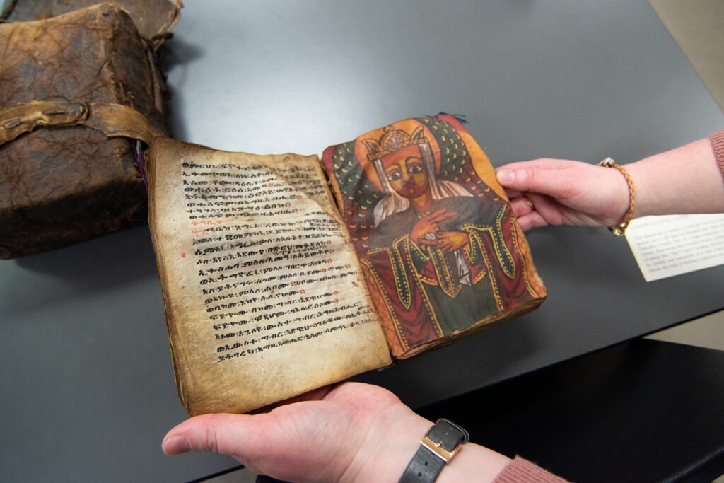 Art Historian Alexa Sand in Marriott Library Special Collections with students from Professor Meekyung MacMurdie's Medieval Art class, March 2023