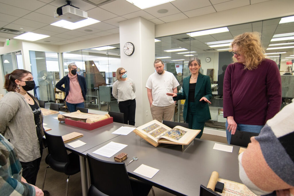 Art Historian Alexa Sand in Marriott Library Special Collections with students from Professor Meekyung MacMurdie's Medieval Art class, March 2023