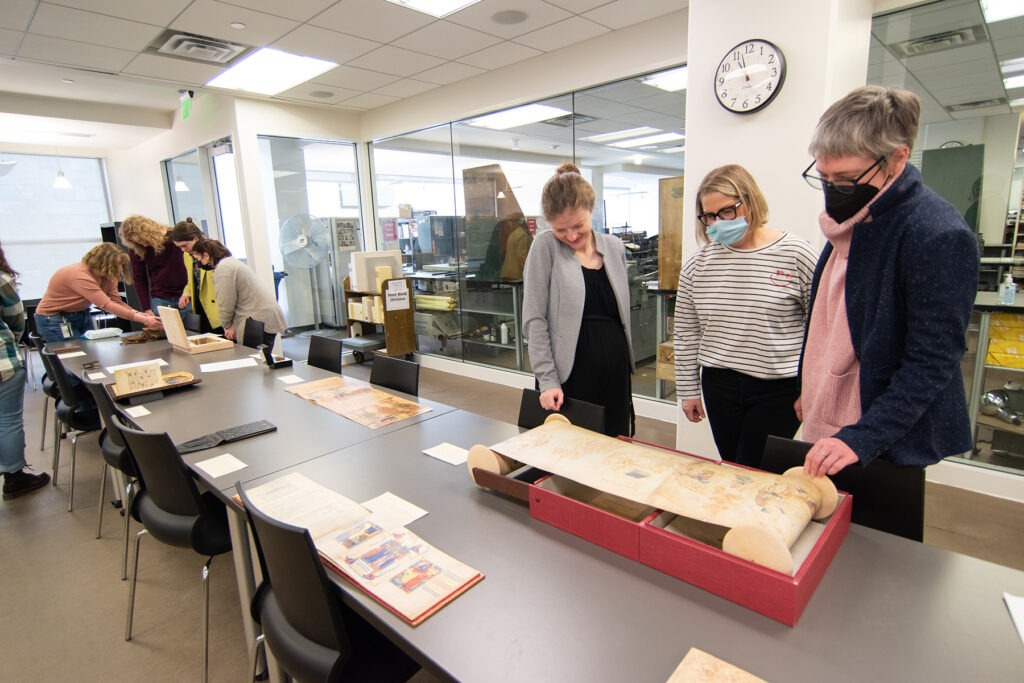 Art Historian Alexa Sand in Marriott Library Special Collections with students from Professor Meekyung MacMurdie's Medieval Art class, March 2023