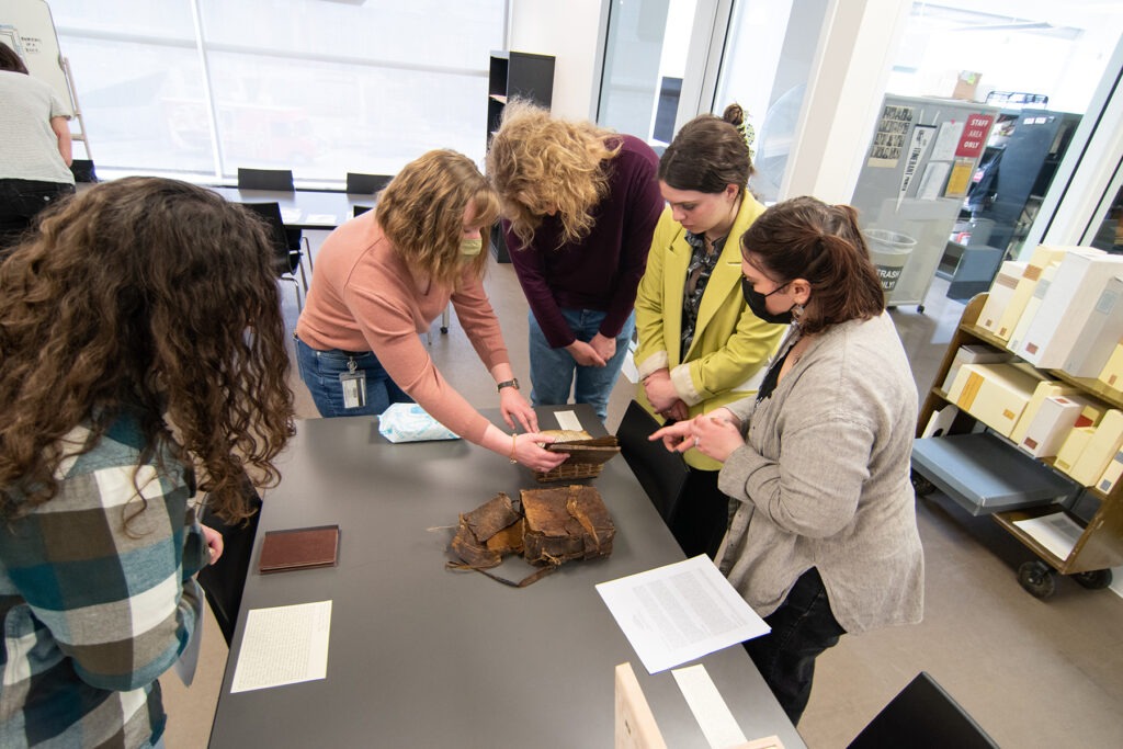 Art Historian Alexa Sand in Marriott Library Special Collections with students from Professor Meekyung MacMurdie's Medieval Art class, March 2023