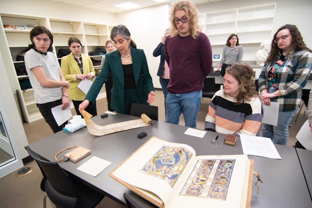 Art Historian Alexa Sand in Marriott Library Special Collections with students from Professor Meekyung MacMurdie's Medieval Art class, March 2023