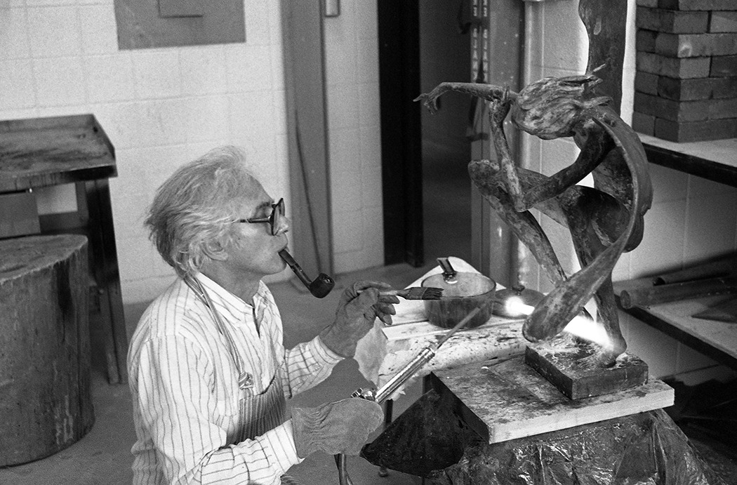 Emeritus Prof. Angelo Caravaglia working on a sculpture.