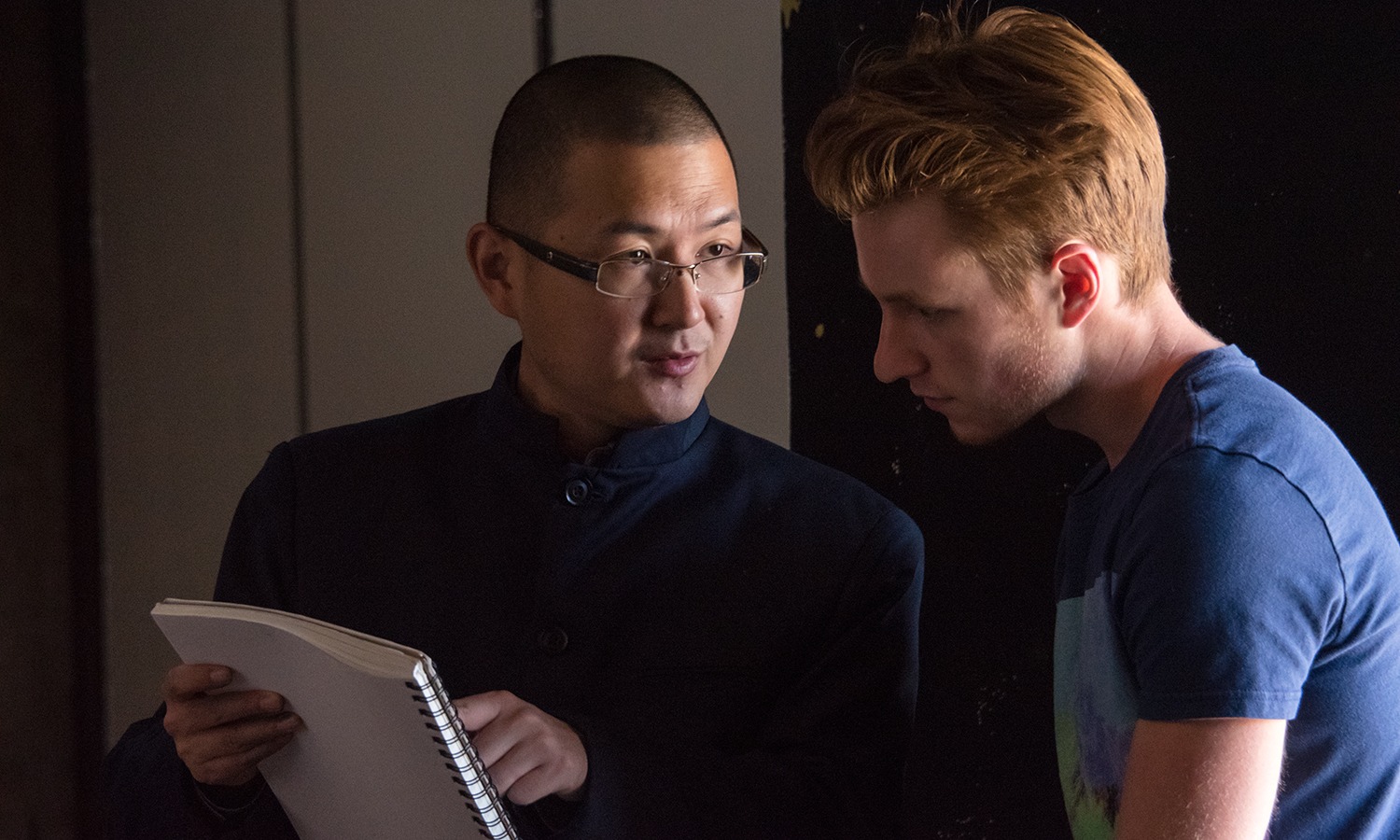 Professor Xi Zhang works with a student